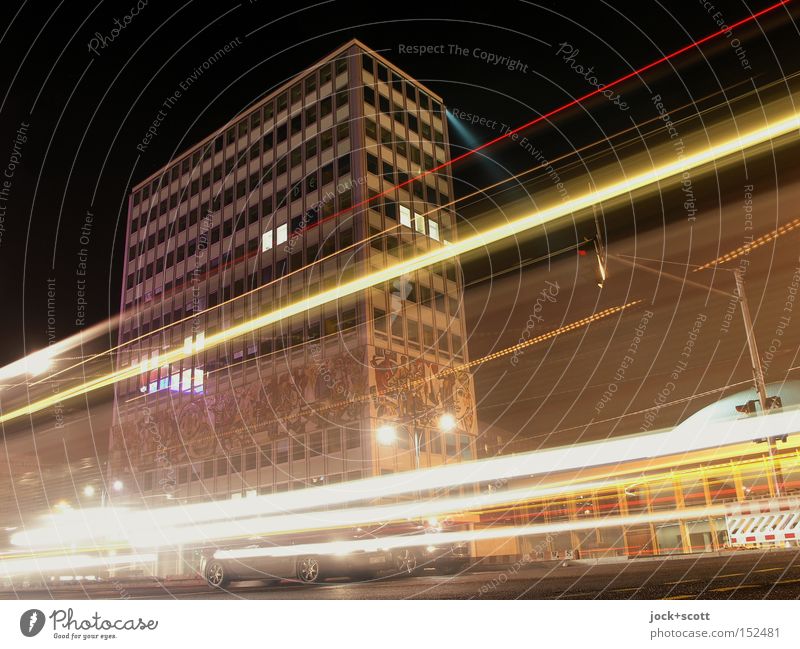 House of the teacher at night Facade Tourist Attraction Traffic infrastructure Traffic light Car Driving Speed Mobility Visual spectacle GDR Night