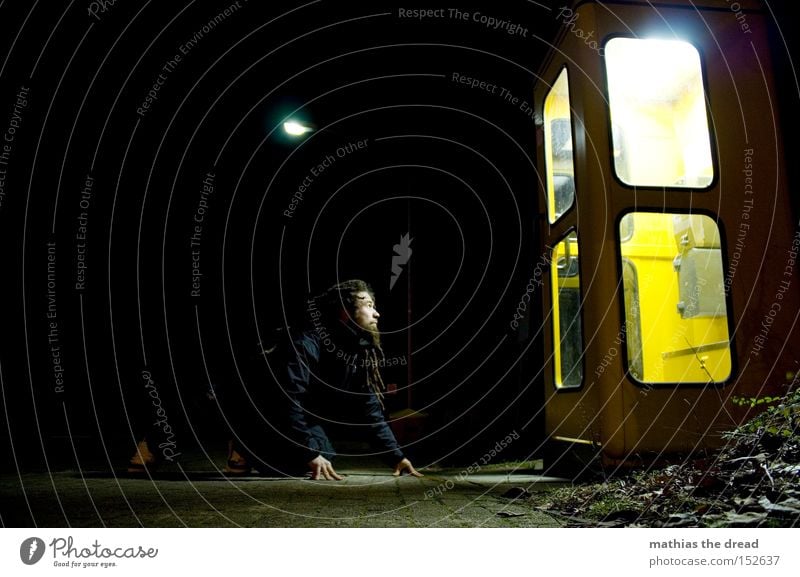 LIGHT BOX II Night Dark Black Phone box Yellow To talk Communicate Telecommunications Lamp Bright Light Man Observe Crouch Wait Attract Looking