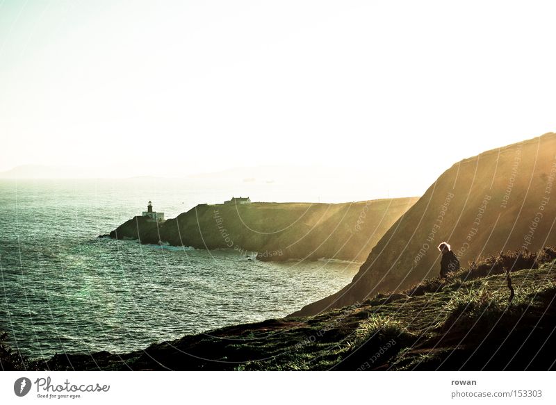 sea view Ocean Lake Vantage point Lighthouse Coast Cliff Rock Ireland Sun Winter Nature Mountain Beach