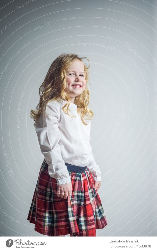 Beautiful smiling blond girl in a school uniform Lifestyle Joy Happy Face Child School Human being Woman Adults Infancy Youth (Young adults) Hand Blonde Smiling