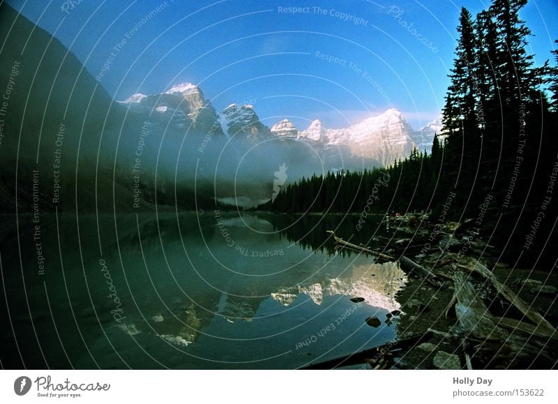 Shadows over Moraine Mountain Lake Water Surface Smoothness Mirror Calm Peace Snow Peak Alberta Banff National Park Morning Canada Peaceful Clarity