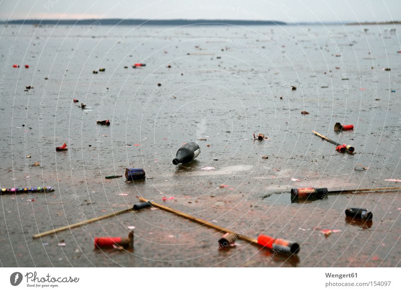 New Year's morning Ice Ocean Winter Firecracker New Year's Eve Trash Transience Hung-over Red Gray Blue Cold Lagoon