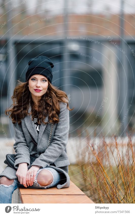 Young woman sitting on the street Lifestyle Elegant Style Joy Happy Beautiful Face Leisure and hobbies Camera Human being Girl Woman Adults Town Street Fashion