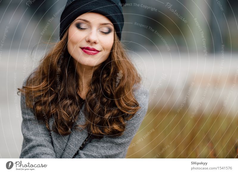 Young woman sitting on the street Lifestyle Elegant Style Joy Happy Beautiful Face Leisure and hobbies Camera Human being Girl Woman Adults Town Street Fashion