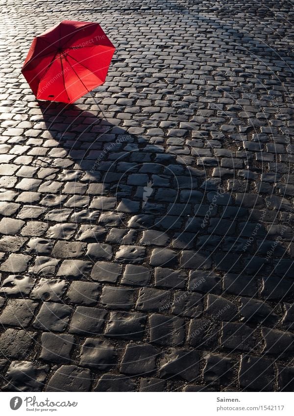 URBAN STILL LIFE Traffic infrastructure Street Lanes & trails Red Umbrella Cobblestones City life Still Life Colour photo Multicoloured Exterior shot Detail