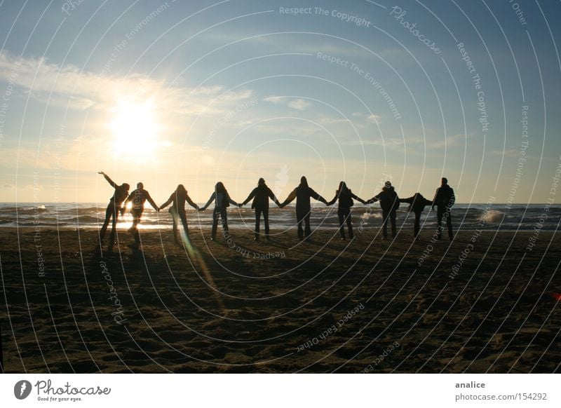 sunset friendship Colour photo Exterior shot Silhouette Sunlight Joy Beach Ocean Waves Human being Friendship Group 18 - 30 years Youth (Young adults) Adults