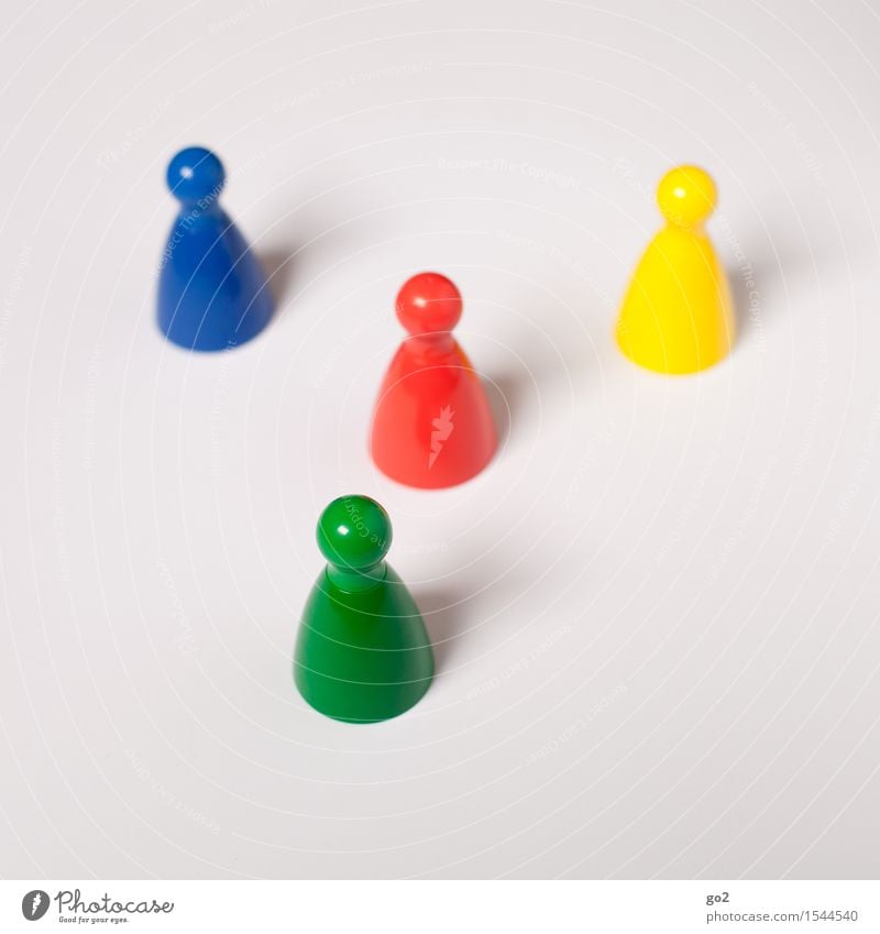 Colourful cones Leisure and hobbies Playing Board game Children's game Meeting To talk Team Skittle Conical Communicate Uniqueness Blue Multicoloured Yellow