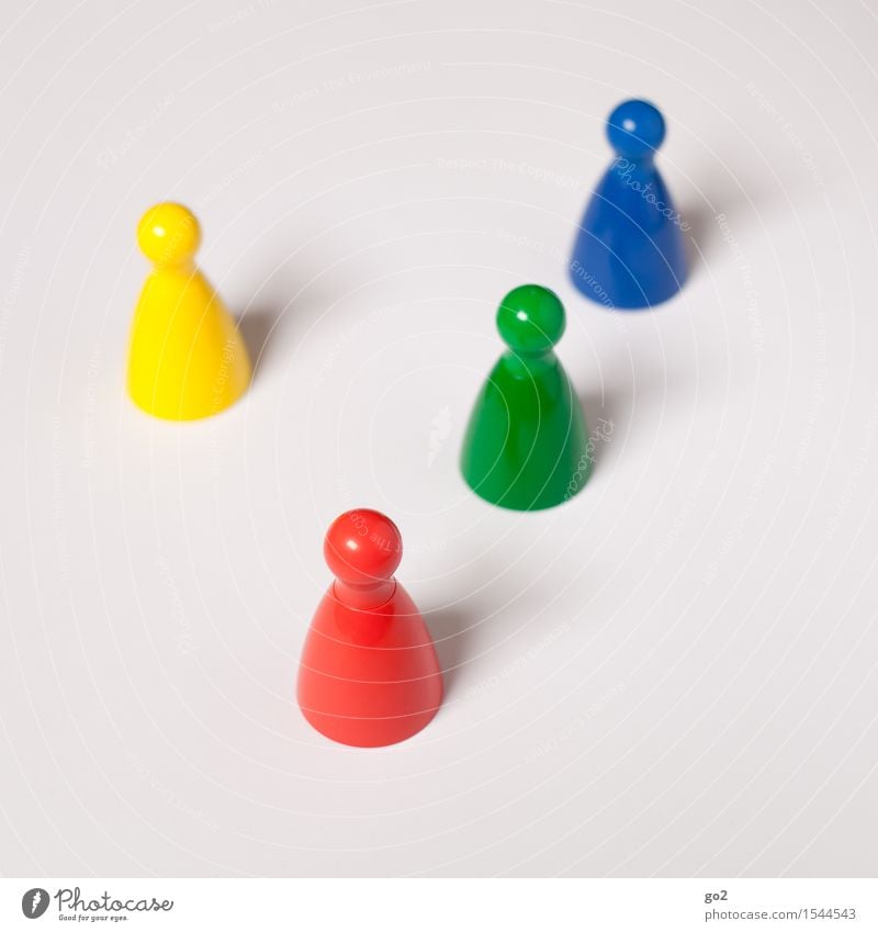 Colourful cones Leisure and hobbies Playing Board game Children's game Meeting To talk Team Skittle Conical Communicate Uniqueness Blue Multicoloured Yellow