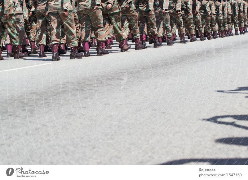 In step Human being Legs Feet Group Crowd of people Footwear Boots Walking Safety Military Colour photo Exterior shot Copy Space bottom Light Shadow