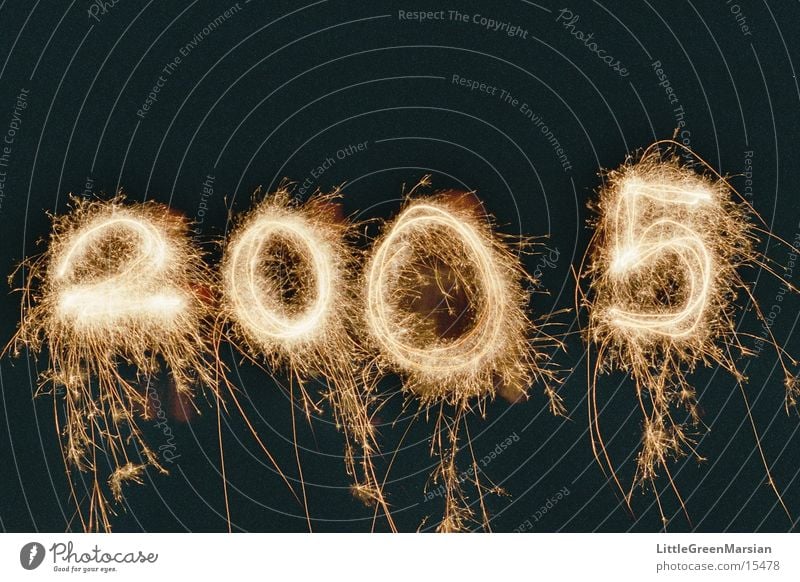 Happy New Year! New Year's Eve Sparkler Spray Long exposure Night Tracer path Digits and numbers 2004 - 2005 Blaze