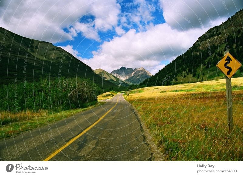 The way into the light Street Lanes & trails Street sign Curve Mountain Clouds Light Shadow Meadow Perspective Alberta Canada Traffic infrastructure