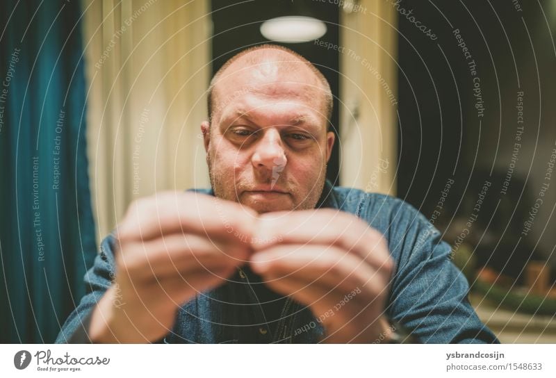 Serious Man Looking at his Fingertips Touching Face Work and employment Human being Adults Hand Fingers Think Sit Considerate balding concentrating Meditative