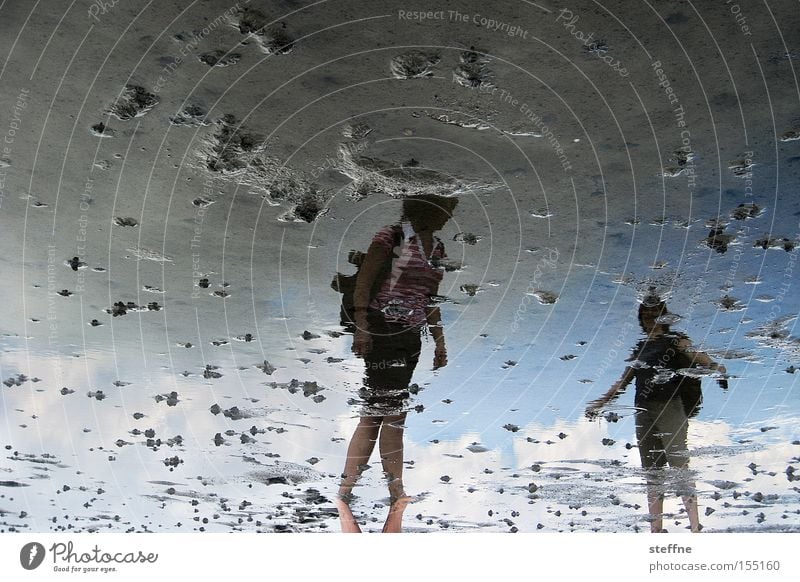 What's going on here? Reflection Mud flats Ocean North Sea Hiking To go for a walk Woman Lugworms Summer Vacation & Travel Low tide Tide Leisure and hobbies