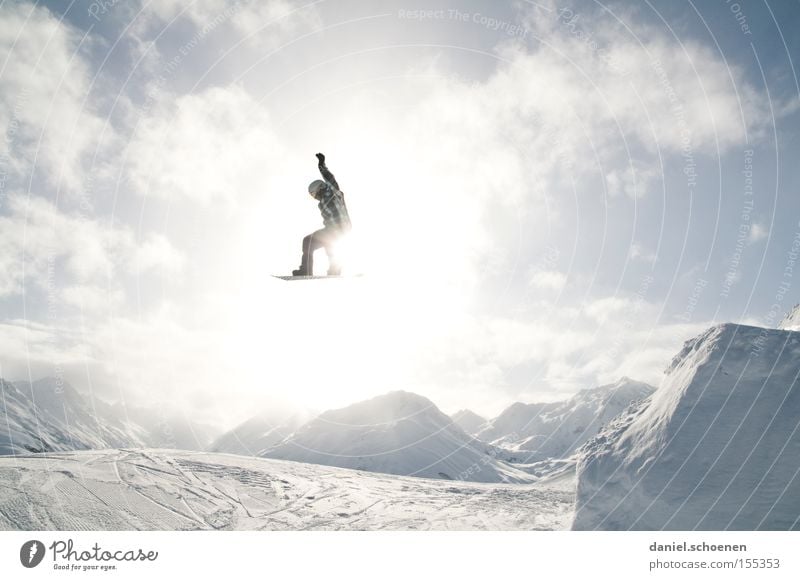 in the light (part 1) Winter Winter sports Joy Clouds Mountain Light Snow Action Snowboarder Snowboarding Tall far Ski jump Fun park Winter sun Back-light