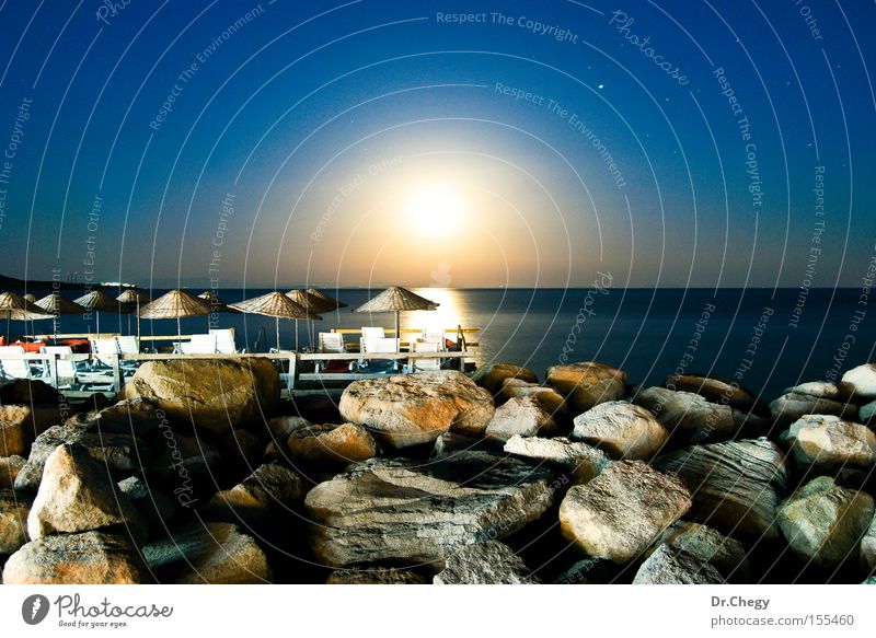 Moonlight in Assos Night sky Blue Stone Light (Natural Phenomenon) Ocean Evening Umbrella Coast Dark Landscape Beach Celestial bodies and the universe