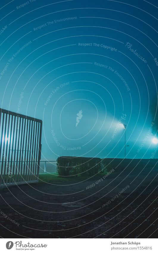 behind the fence the football field III Creepy Gloomy Blue Sadness Concern Reluctance Pain Twilight Dreary Football pitch Fence Barrier Back-light Floodlight