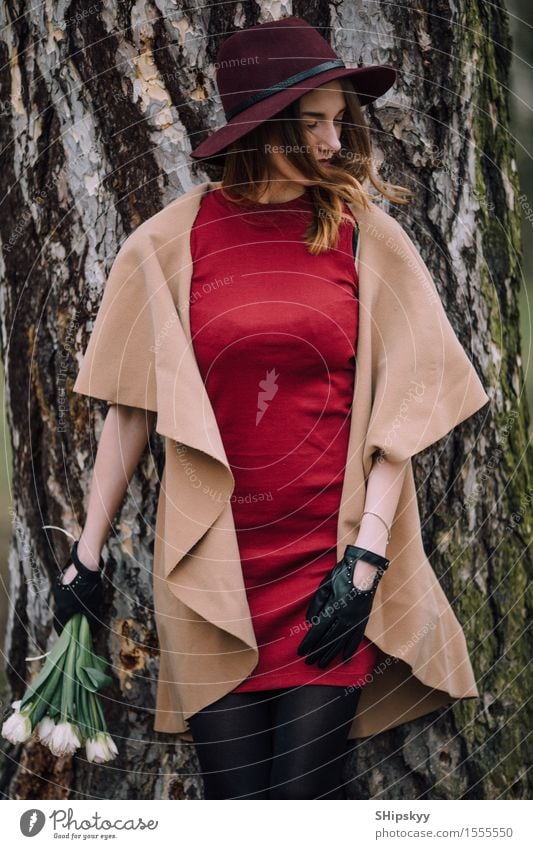 Woman standing on the park background with flowers Elegant Style Beautiful Garden Human being Girl Adults Nature Weather Flower Tulip Park Fashion Clothing