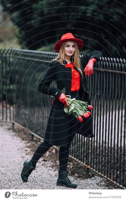 Woman standing on the park background with flowers Elegant Style Beautiful Garden Human being Girl Adults Nature Weather Flower Tulip Park Fashion Clothing