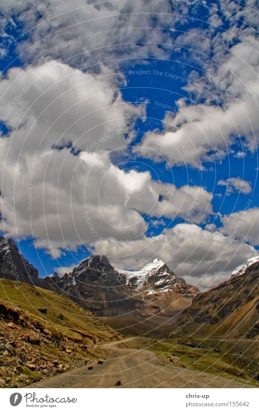 Road in the Andes Highlands, Peru Street Lanes & trails Landscape High plain Mountain Clouds Sky Snow Peak South America Rock Traffic infrastructure rock massif