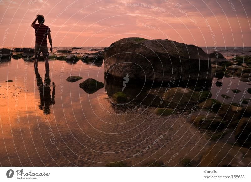 landmark Rügen Ocean Water Mirror Baltic Sea Silhouette Human being Sunset Twilight Stone Reflection Romance Sky Evening Wanderlust Goodbye Grief Distress Beach