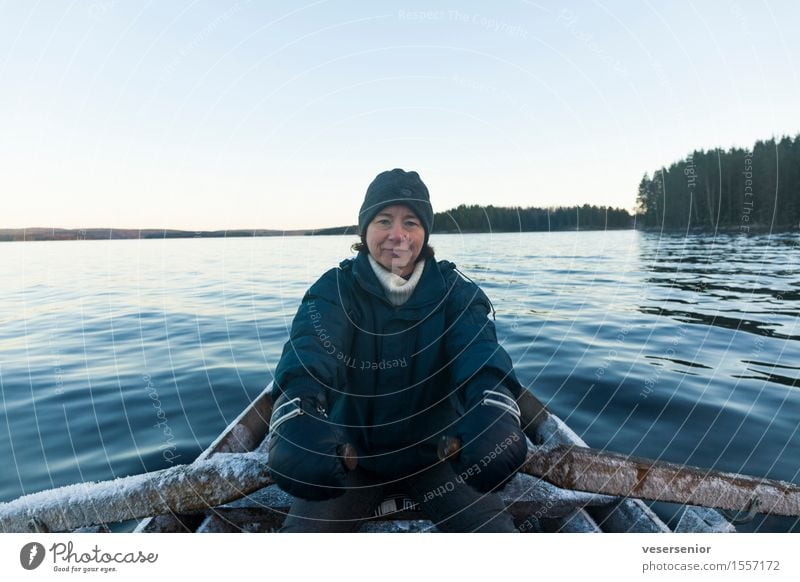 last boat trip before winter Trip Winter Feminine Woman Adults 1 Human being 45 - 60 years Nature Cloudless sky Autumn Ice Frost Lake warm Freeze Authentic