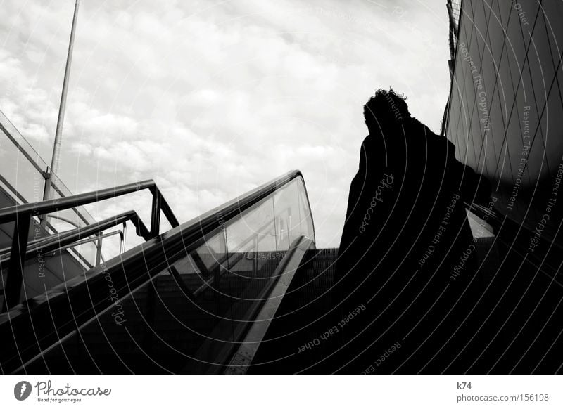 exit Way out Underground Paris Métro Escalator Human being Hair and hairstyles Wind Back-light Silhouette Tall Sky Upward Train station Black & white photo