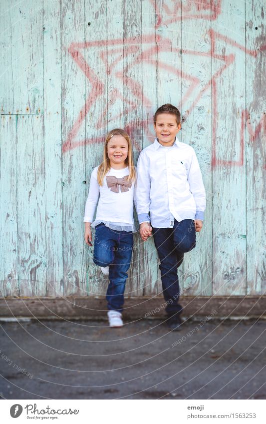 Siblings - boy and girl holding hands and laughing at camera Masculine Feminine Girl Boy (child) Brothers and sisters Infancy 2 Human being 13 - 18 years