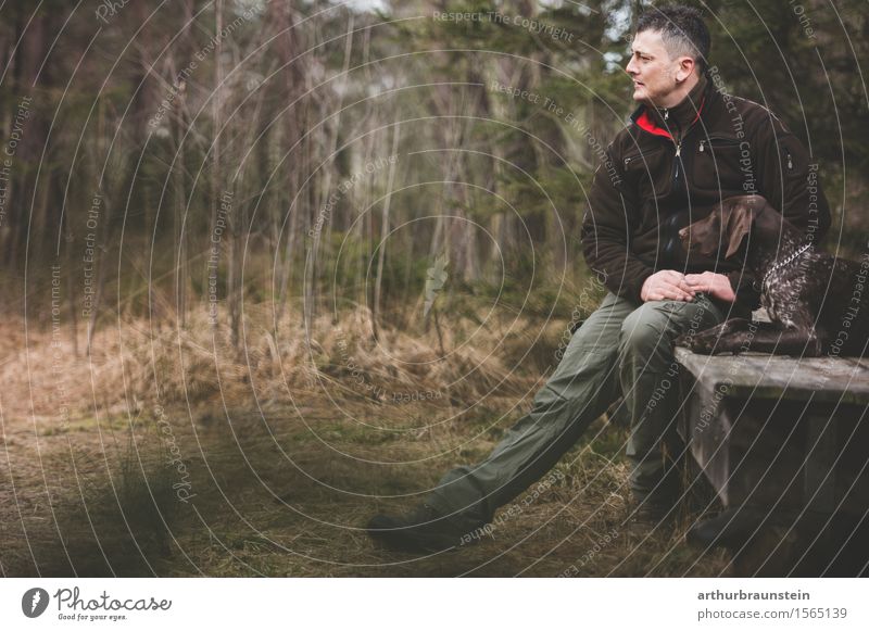 Man with dog in front of wooden hut Leisure and hobbies Hunting Human being Masculine Young man Youth (Young adults) Friendship Life 1 30 - 45 years Adults