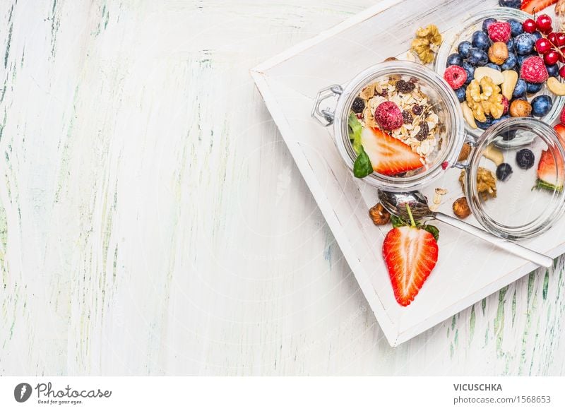 Healthy breakfast with muesli in a glass and berries Food Fruit Grain Dessert Nutrition Breakfast Buffet Brunch Organic produce Vegetarian diet Diet Glass Spoon