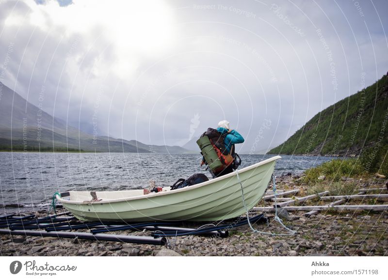 disembarked Life Trip Adventure Freedom Hiking Human being Young woman Youth (Young adults) Nature Landscape Clouds Bad weather Gale Rain Mountain Lake Rowboat