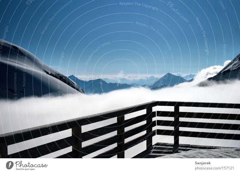 cloud ship Mountain Horizon Grossglockner High mountain region Alps Austrian Alps Hut Alpine hut Handrail Clouds Above the clouds Loneliness Winter