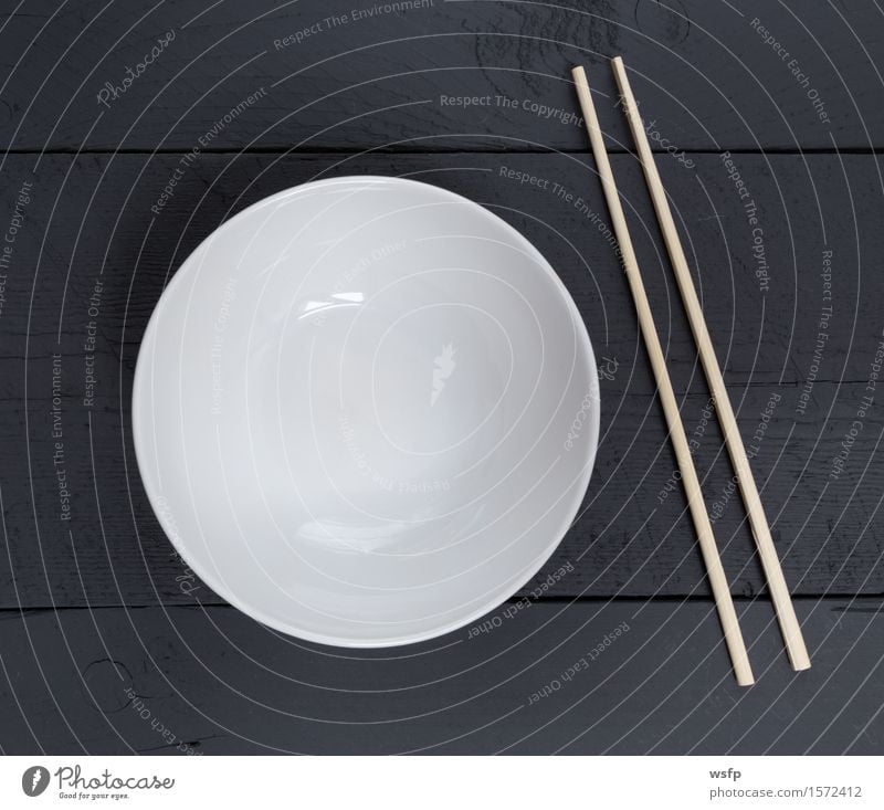 Bowl with sticks on black wood in bird's eye view Restaurant Gastronomy Old Black White shell Chopstick Anthracite Empty Wooden board Wooden table Wooden sign