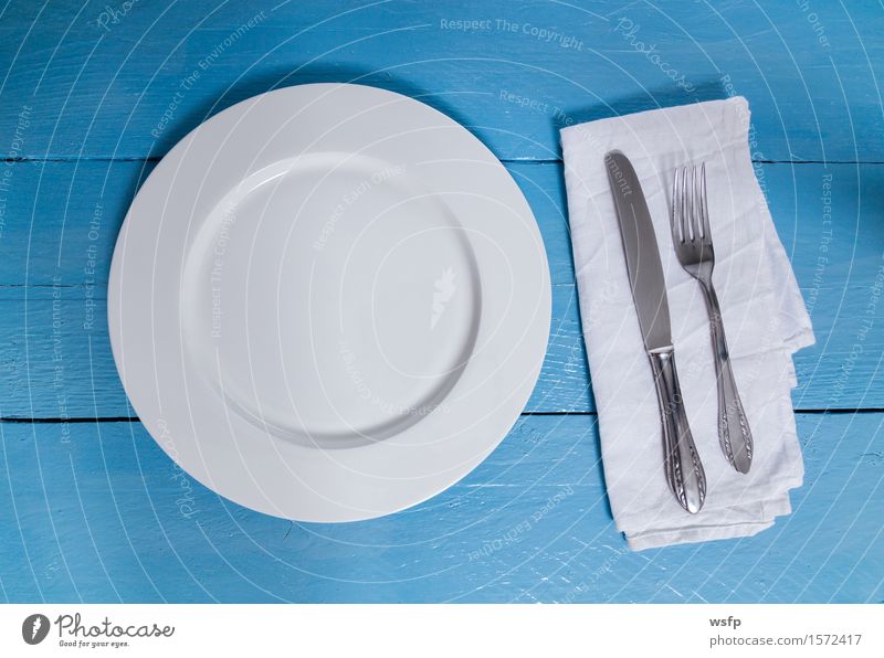 Cutlery and plate on blue wood background Plate Fork Kitchen Restaurant Gastronomy Old Blue White Empty Napkin Knives Wooden board Wooden table Wooden sign