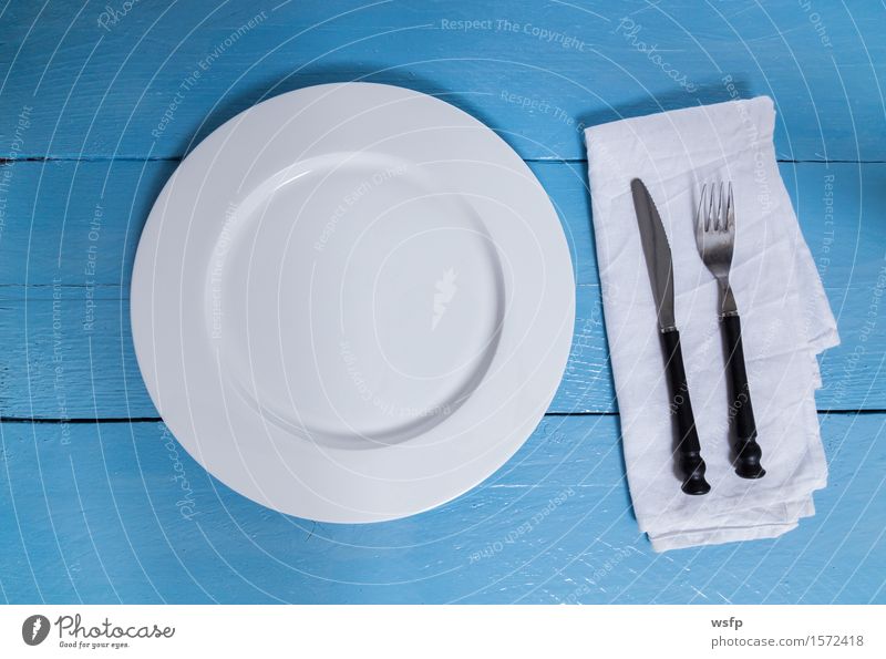 Cutlery and plate on blue wood background Plate Fork Kitchen Restaurant Gastronomy Old Blue White Empty Napkin Knives Wooden board Wooden table Wooden sign