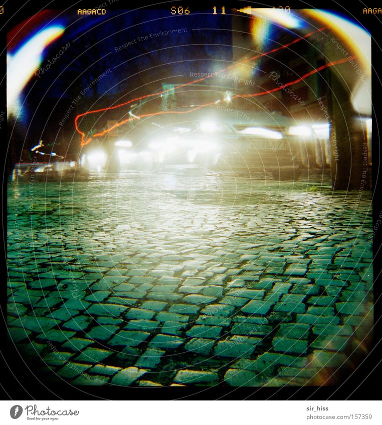 Monday morning in front of the school Lomography Transport Motor vehicle Cobblestones Street Light Long exposure Car Take a photo Art Car headlights Back-light