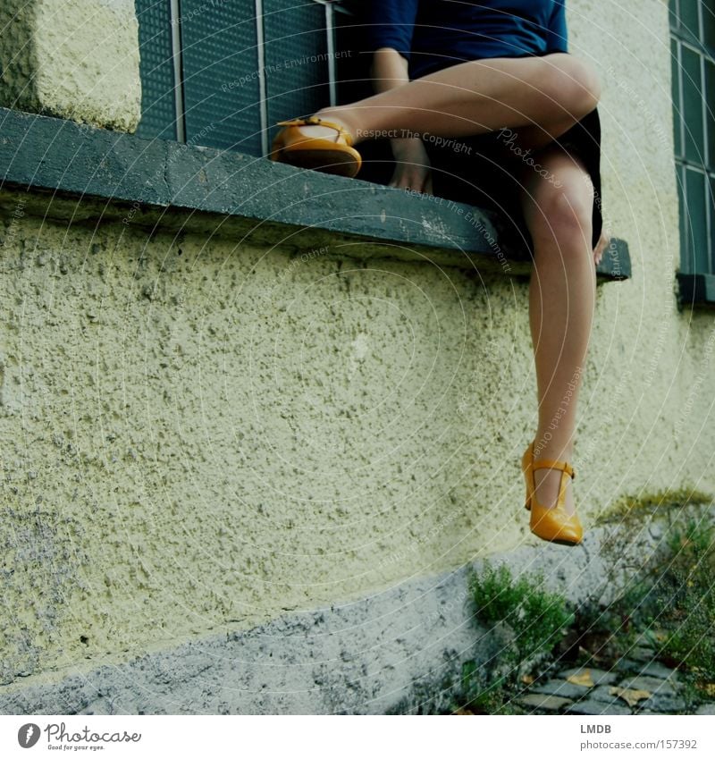 yellow shoes, short skirts Yellow Footwear Woman Dress Sit Relaxation Wait Knee Headless Street Legs window sills Paving stone Exterior shot