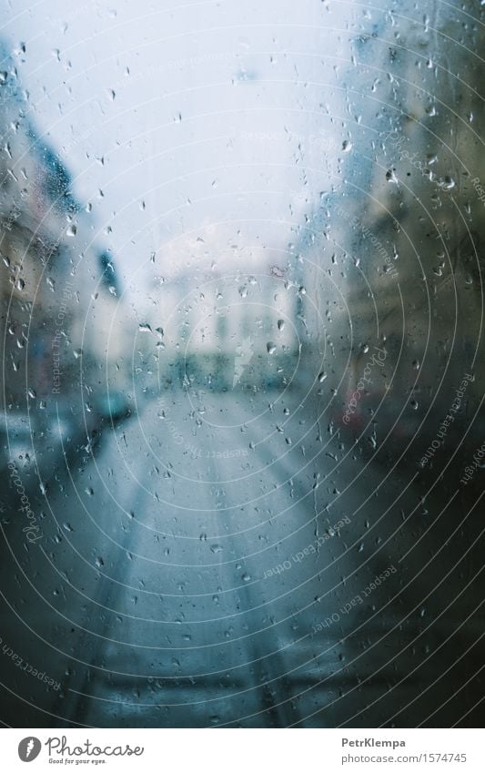 Raindrops on glass in the city Town Pedestrian precinct Window Transport Street Car Rail transport Train travel Railroad Glass Art Colour photo Exterior shot