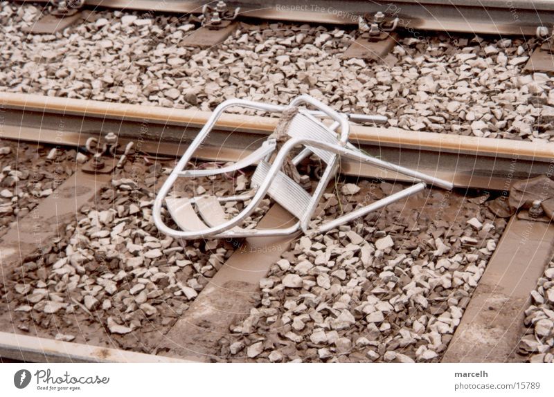 chair Railroad tracks Accident Sudden fall Tragedy Dangerous Fear Panic Chair capped Silver cafe chair