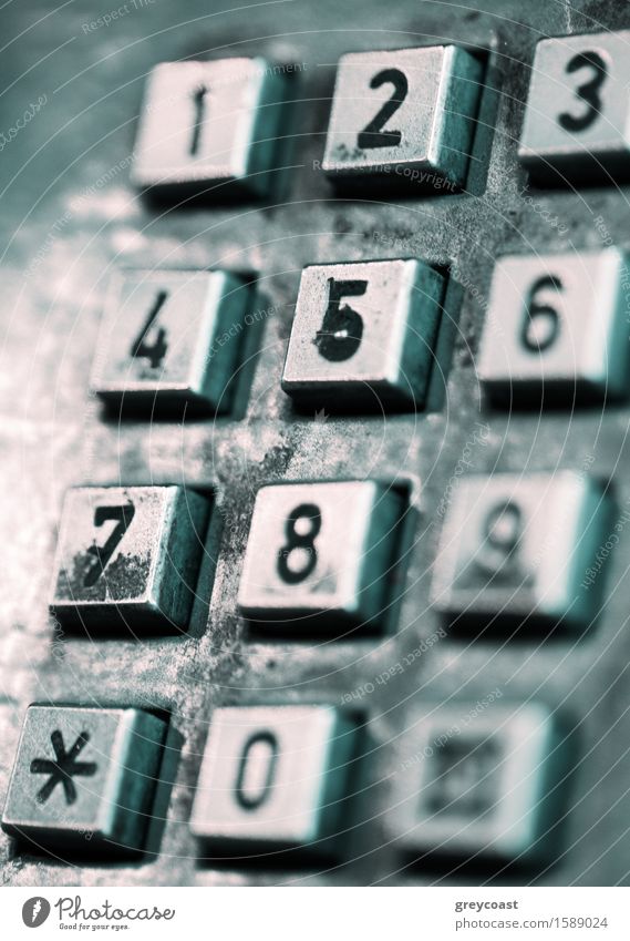 The buttons of an old-style street public telephone. Shallow depth of field. Telephone Street Metal Old Dark Retro Gray Black cell Buttons vintage shallow dof