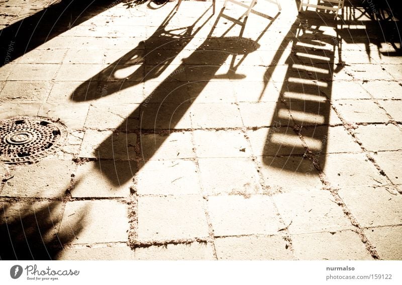 Tomorrow, as he becomes. . . Morning Shadow Chair Deckchair Floor covering Ground Stone Pattern Graphic Summer Garden Courtyard Warmth Sunrise Sunbeam Joy