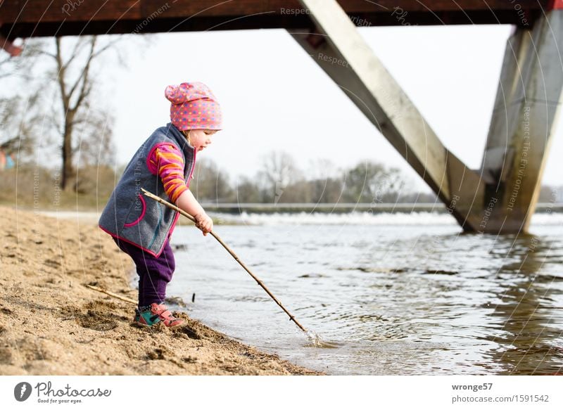 Playing at the river Child Toddler Girl Infancy 1 Human being 1 - 3 years River bank Beach Elbe Waterfall Wet Brown Gray Joy Effortless Bridge Sandy beach