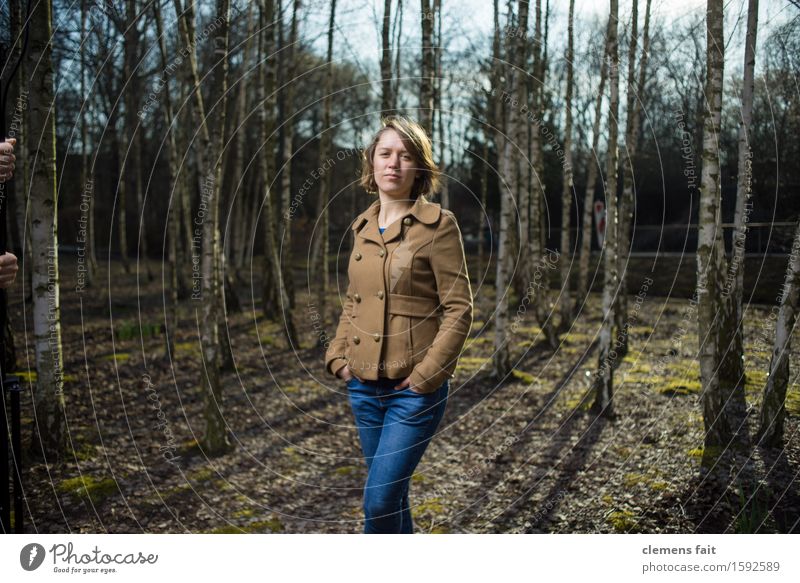 In the birch grove III Young woman Girl Clothing Fashion Posture Brown Jacket Back-light Birch tree Clump of trees Forest Park Jeans Flash photo Afternoon