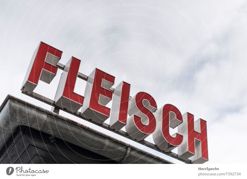 meating point Sky Clouds Characters Gray Red Neon sign Meat Butcher Roof Eaves Advertising Market stall Carnivore Colour photo Exterior shot Deserted