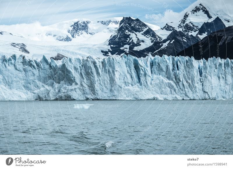 iceberg factory Mountain Snowcapped peak Glacier Coast Gigantic Cold Blue White Climate Transience Perito Moreno Glacier Edge Glacier ice Copy Space bottom