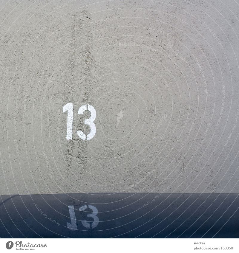 The Wild Thirteen 13 Digits and numbers Parking lot Wall (building) House number Blue Work and employment Happy Popular belief Traffic infrastructure Success