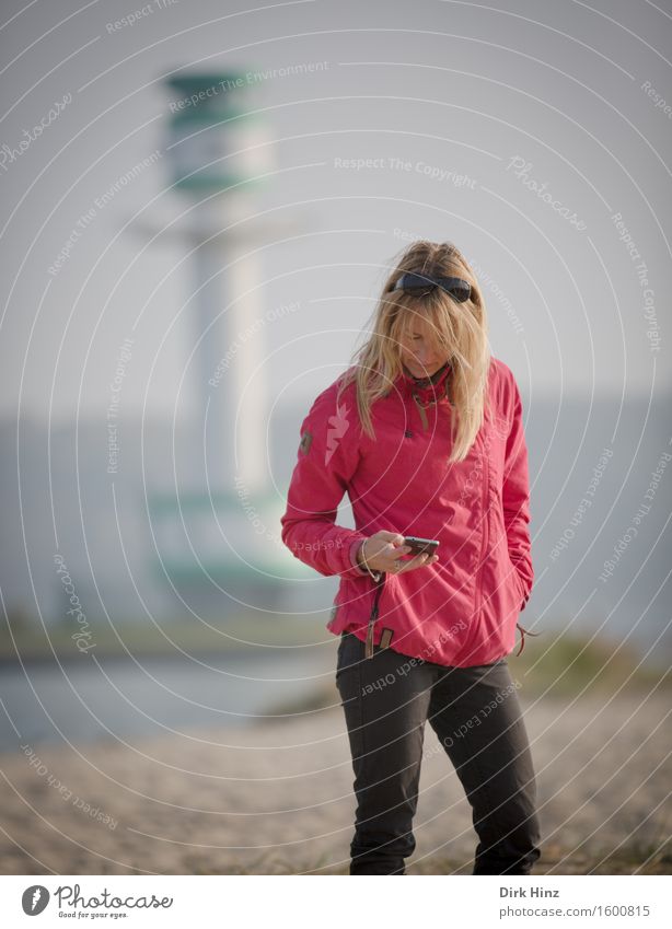 Woman near a lighthouse looking at her smartphone Style already Healthy Leisure and hobbies Vacation & Travel Tourism Trip Far-off places Summer Summer vacation