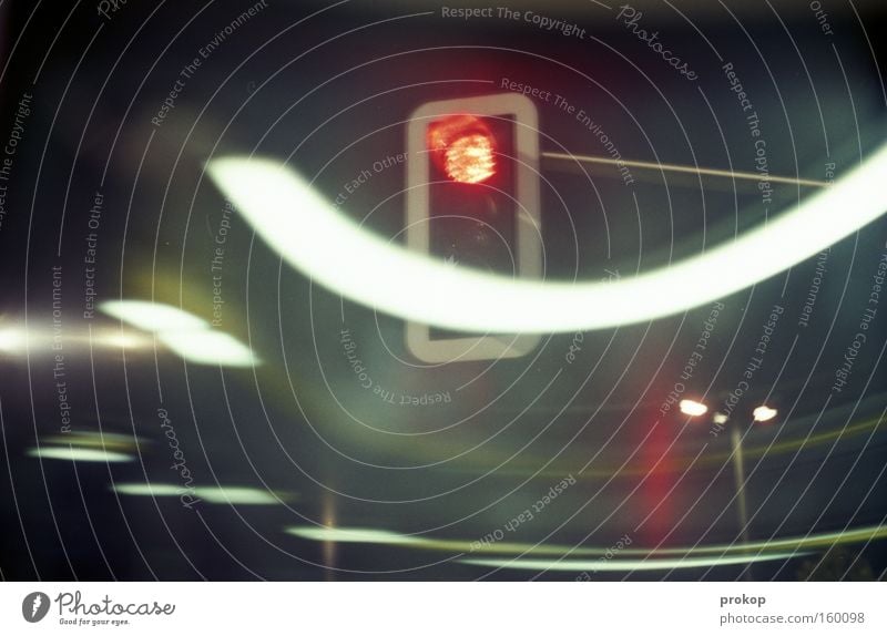 Swayed by the night Traffic light Night Dark Light Movement Red Stop Transport Driving Curve Long exposure Wait Joy Brakes