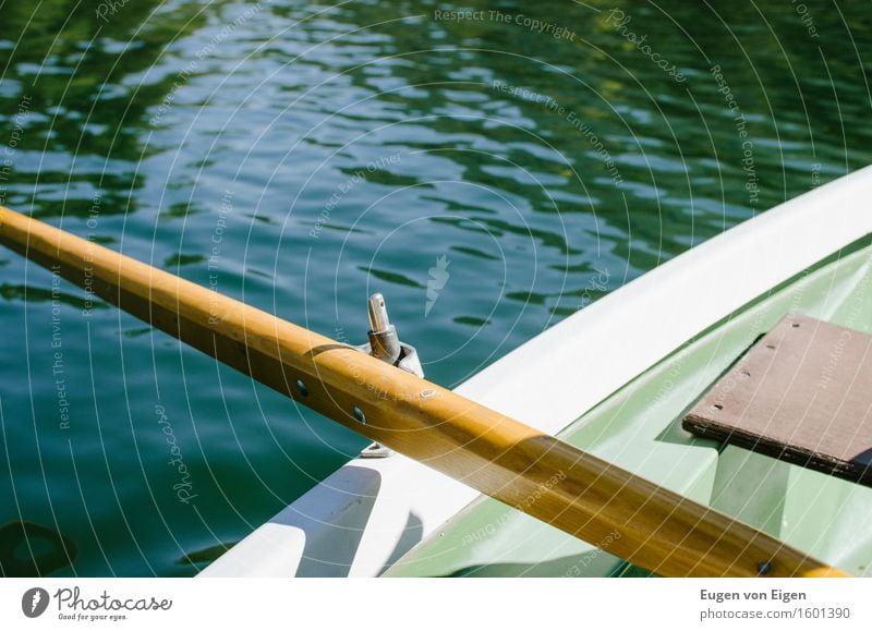 Rowing a rowing boat in an alpine lake Well-being Relaxation Calm Camping Summer vacation Sun Water Lake Mountain lake Rowboat Safety To console Grateful