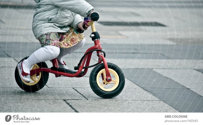 I'm already practicing for the Tour de France... Colour photo Subdued colour Exterior shot Detail Day Worm's-eye view Playing Bicycle Child Study Human being