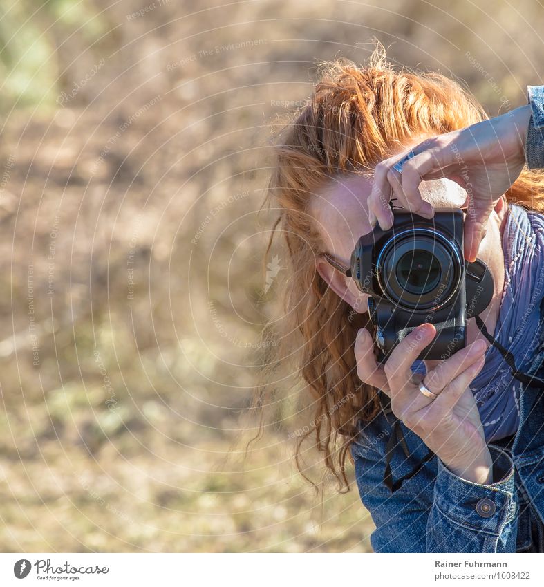 a woman takes pictures with a digital camera Take a photo Profession Photographer Advertising Industry Feminine Woman Adults 1 Human being Hunting Culture Art